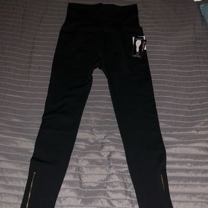 Black leggings with gold ankle zipper